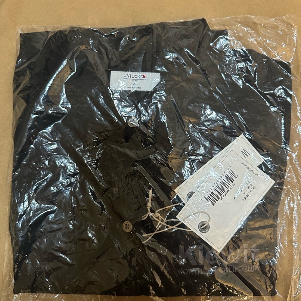 Black polo shirt. Size 4 women